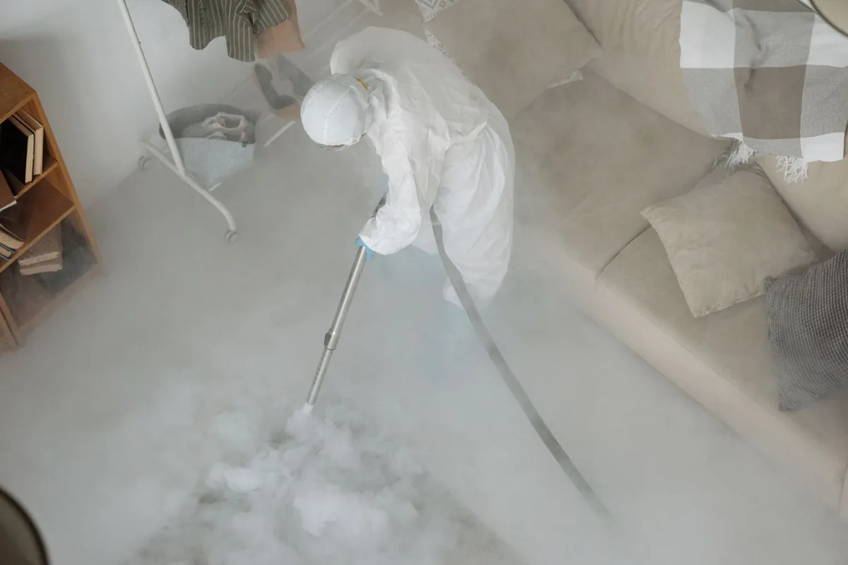 Biohazard cleanup technician in protective equipment, Herricks, NY